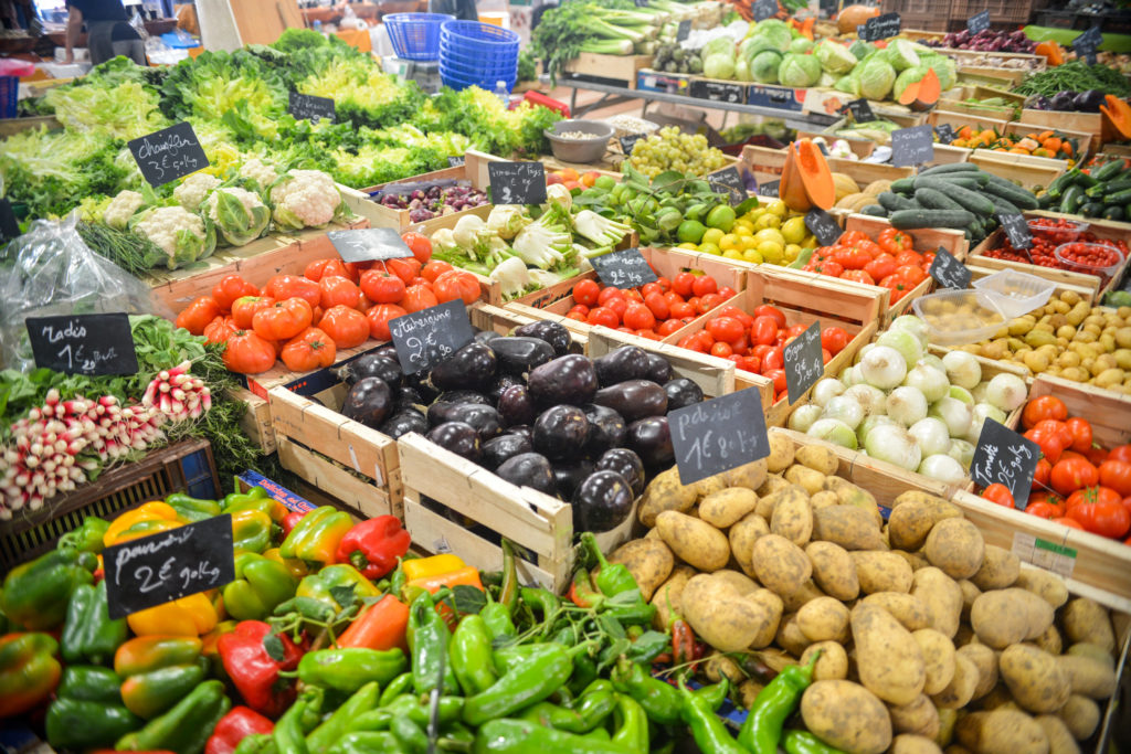 Picture of fruits and vegetables in bins