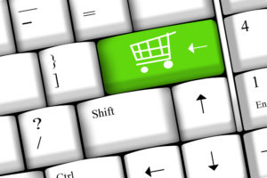 This is a picture of a green shopping cart button on a keyboard.